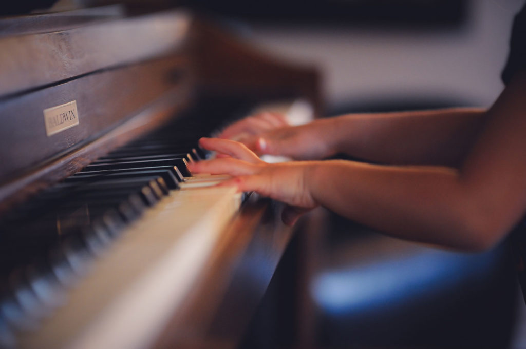 Budget Piano Movers playing a piano